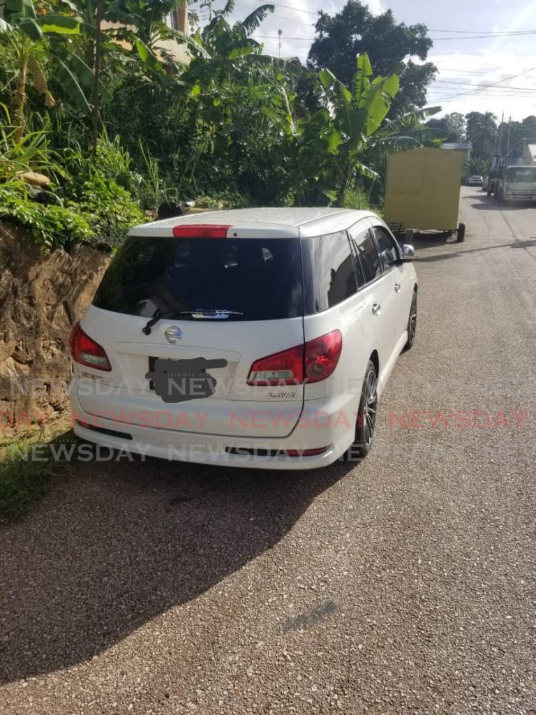 A Nissan Wingroad found along Seales Avenue, Morvant, on Wednesday by police. - TTPS