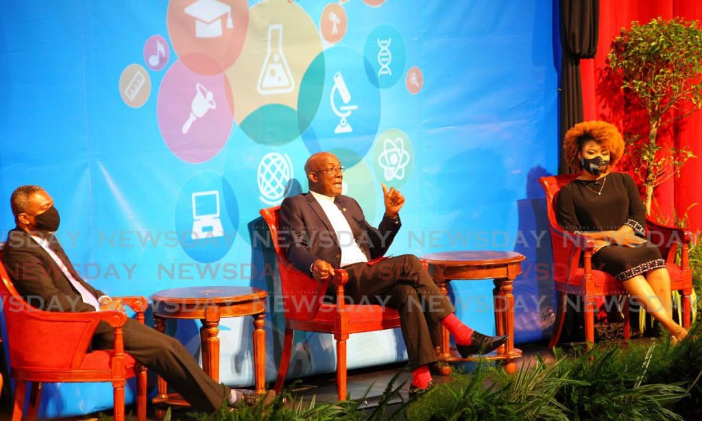 Prime Minister Dr Keith Rowley, centre, speaks at the spotlight on education forum at the National Academy for the Performing Arts, Port of Spain on Thursday. Education Minister Dr Nyan Gadsby-Dolly and Minister in the Ministry of Public Administration and Digital Transformation Hassel Bacchus also spoke at the forum. PHOTO BY ROGER JACOB. - 