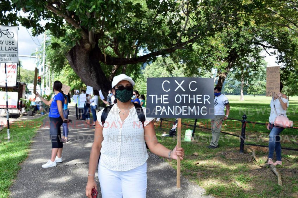 File photo: Sherry Sookhoo parent representative of the group Justice for CSEC & CAPE 2020 carries a placard during a protest over CXC results by members, including students, at Queen's Park Savannah, in November 2020. Photo by Vidya Thurab 