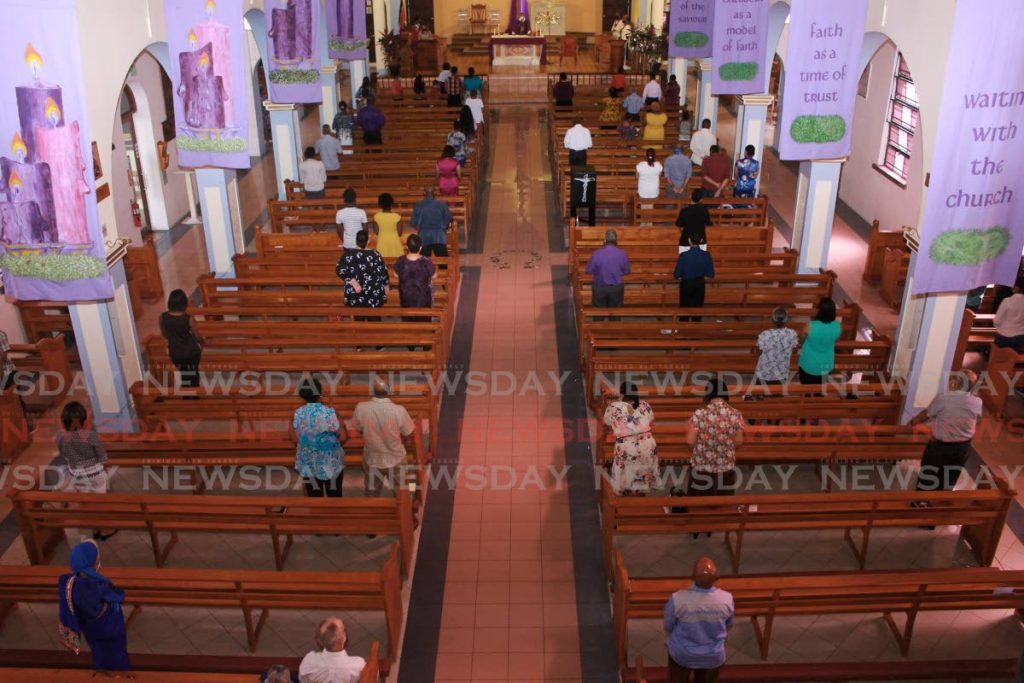 Parishioners at the Lady of Perpetual Help, practice physical distancing during service on Sunday. - CHEQUANA WHEELER