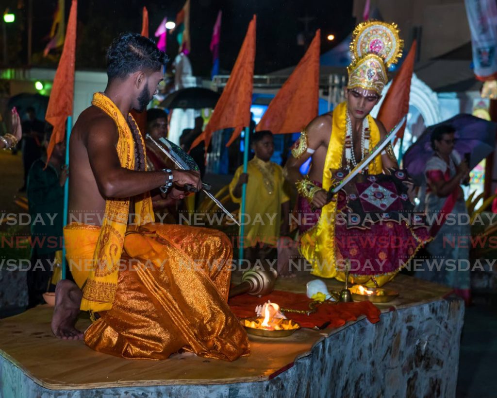 Members of the Shiva Gana Organization perform aarti at the 2019 Divali Nagar celebrations in Chaguanas. - 