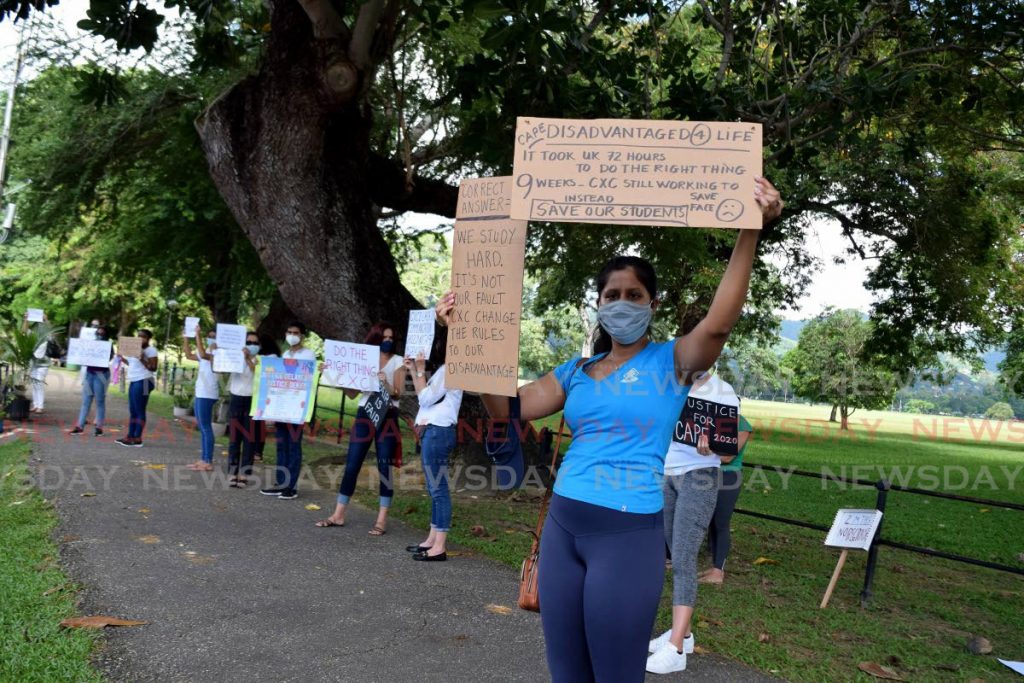 Members of the group 'Justice for CSEC & CAPE 2020' protest aloong Queen's Park Savannah opposite Queen's Royal College on November 28. PHOTO BY VIDYA THURAB - 