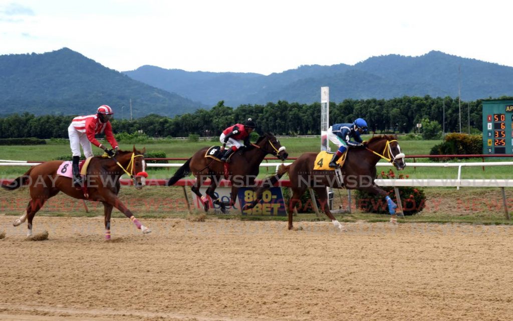 Wise Guy (4) crosses the finish to win the Trinre Derby Stakes on November 28, at the Santa Rosa Park, Arima.  - Ayanna Kinsale