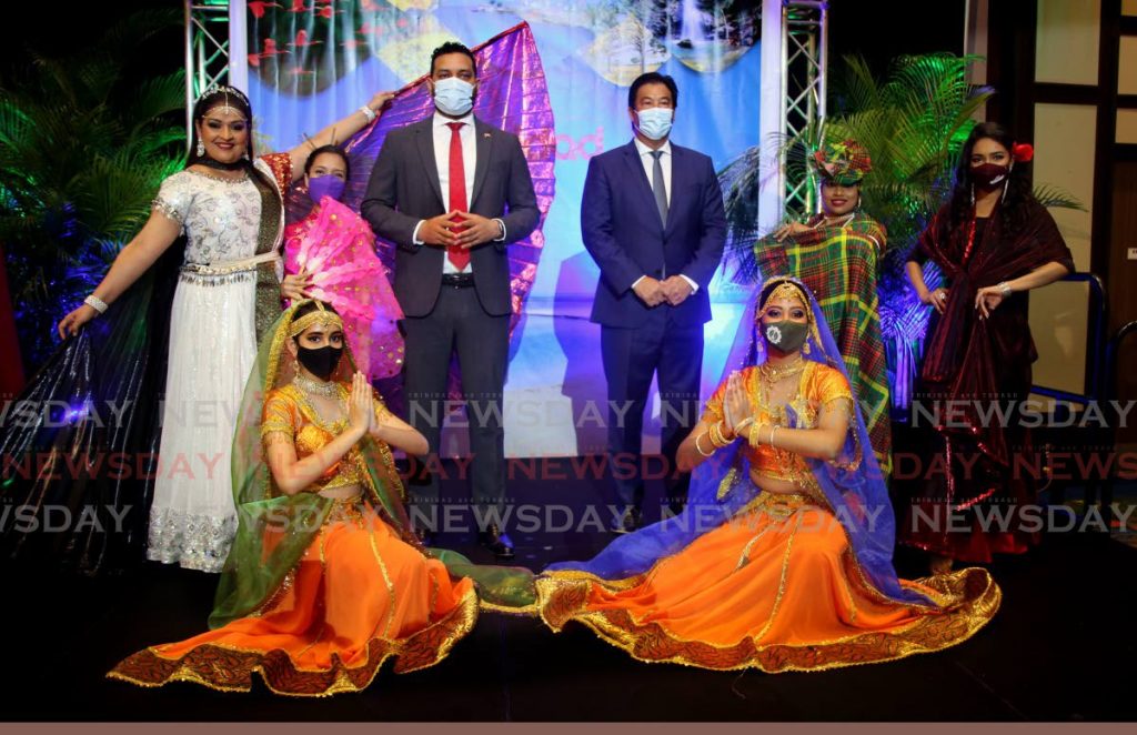 Minister of Tourism, Culture and the Arts, Randall Mitchell, centre left, and Tourism Trinidad Ltd Chairman Howard Chin Lee, centre right, with members of the Susan Mohip Dance Group at the launch of Destination Trinidad website at Hilton Trinidad & Conference Centre, Lady Young Road, Port of Spain, on Monday. - SUREASH CHOLAI