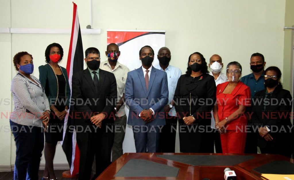 Minister of Youth Development and National Service Minister of Youth Development and National Servvice Fitzgerald Hinds, centre, with his Permanent Secretary Farook Hosein and acting Deputy Permanent  Secretary Claire Davidson-Williams, flanking him poses with members of the Advisory Friendly Societies at his head office on Elizabeth Street, St. Clair, Port of Spain. - Ayanna Kinsale
