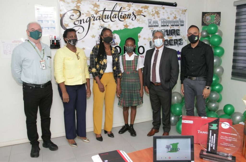 Graham Balchin, CEO TOFCO; Ms Forteau, principal, Vance River RC; Olive Sobers, Adeola’s mom; Adeola Jack , top student; Stephen 
Mc Clashie, MP La Brea; and Javed Mohammed, general manager, TOFCO. - 
