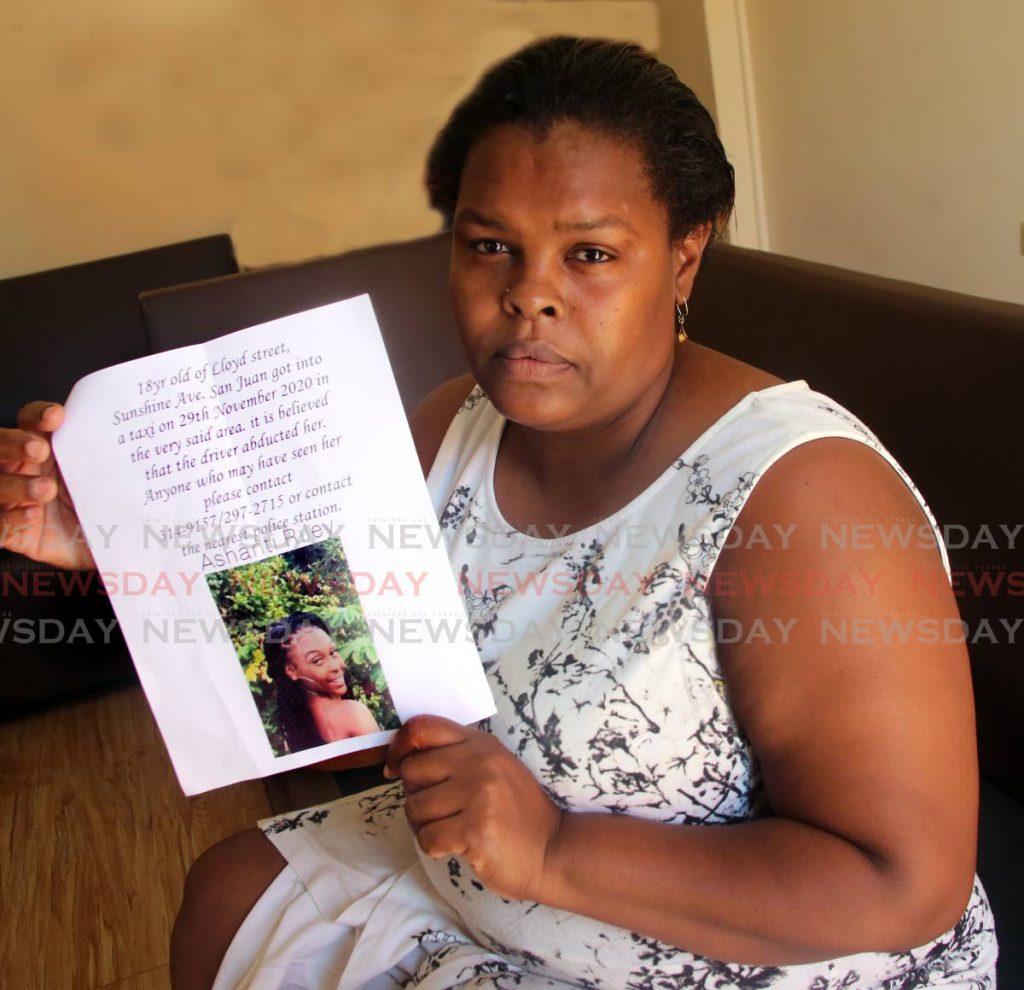 Candice Riley holding a photo of her missing daughter Ashanti Riley at her home at Lloyd's Street , off Sunshine Avenue in San Juan. - SUREASH CHOLAI