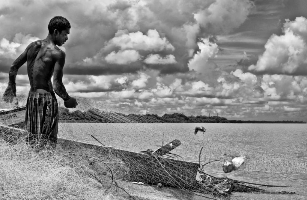 A photo of a fisherman by Sarita Rampersad. Photo courtesy Sarita Rampersad