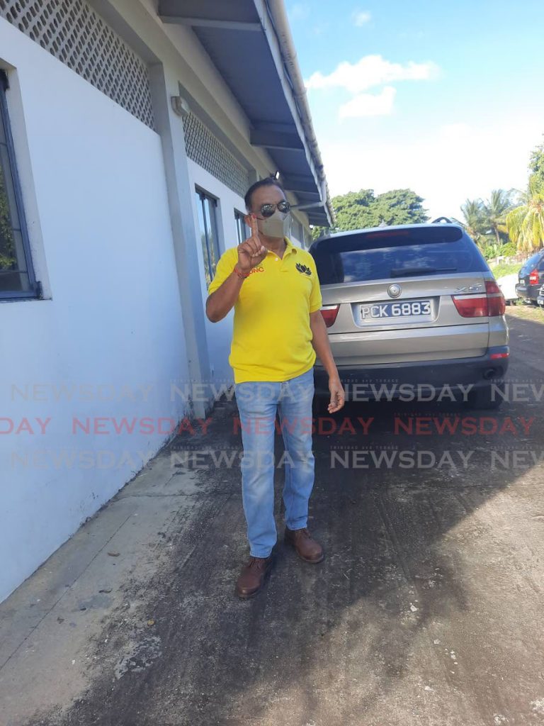 UNC political leader candidate Vasant Bharath shows his stained finger after voting at the Aranguez Community Centre on Sunday - Paula Lindo