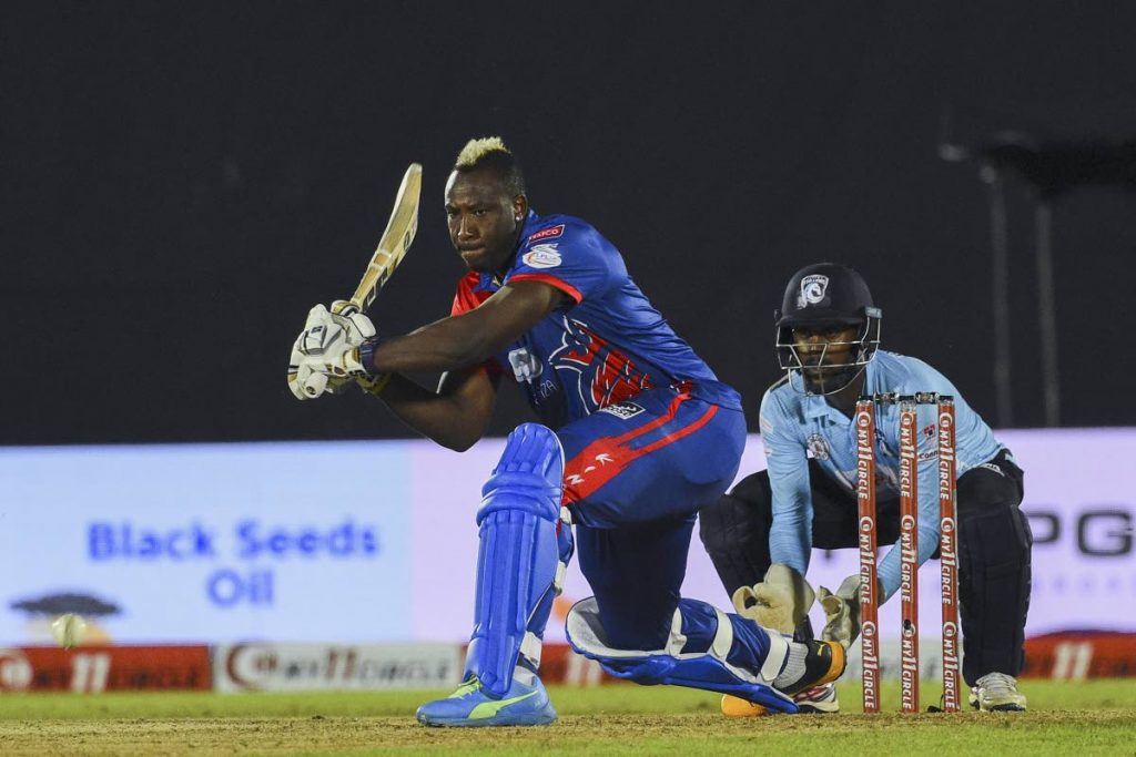 Colombo Kings Andre Russell (L) plays a shot during the Lanka 
Premier League (LPL) cricket match between the Jaffna Stallions and Colombo Kings at the Suriyawewa Mahinda Rajapaksa 
International Cricket Stadium in Hambantota on Dec 4. (AFP PHOTO) - 