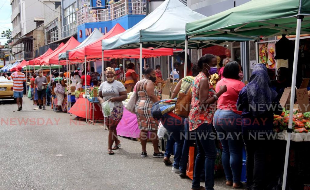 Shoppers look for bargains among stalls on Charlotte Street, Port of Spain on Saturday. The Health Minister said another lockdown was not an option to deal with containing covid19. PHOTO BY SUREASH CHOLAI - 