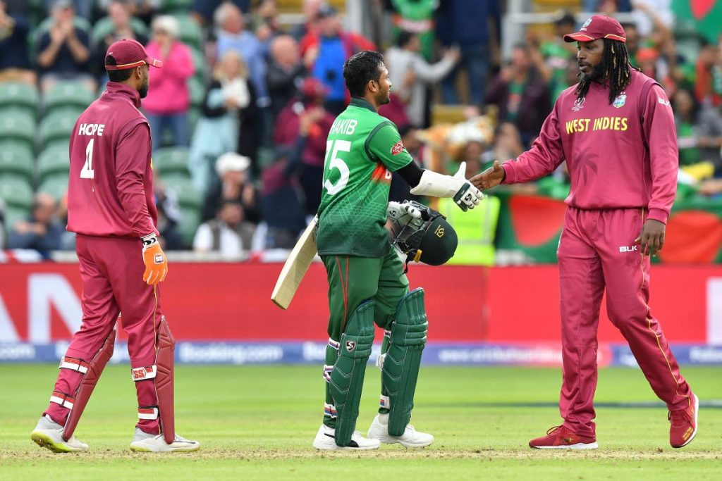 In this June 17, 2019 file photo, West Indies' Chris Gayle (R) shakes hands with Bangladesh's Shakib Al Hasan during the 2019 Cricket World Cup group stage match between West Indies and Bangladesh at The County Ground in Taunton, southwest England. - (AFP PHOTO)