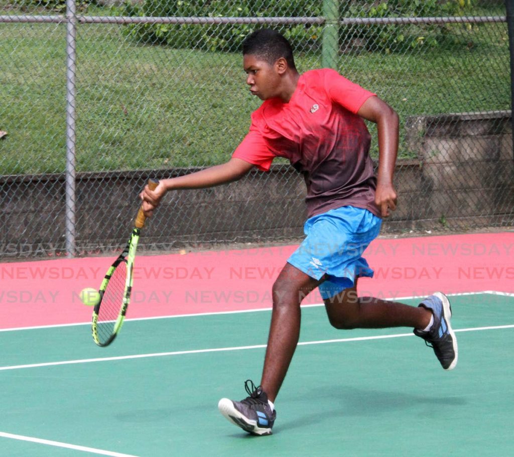 Yeshowah Campbell-Smith returns a serve from, Aaron Subero in the RBC Junior Tennis tournament, during the Boys 14, Singles Division 1 Semi-Finals, at Country Club, Maraval on Wednesday.  - Angelo Marcelle