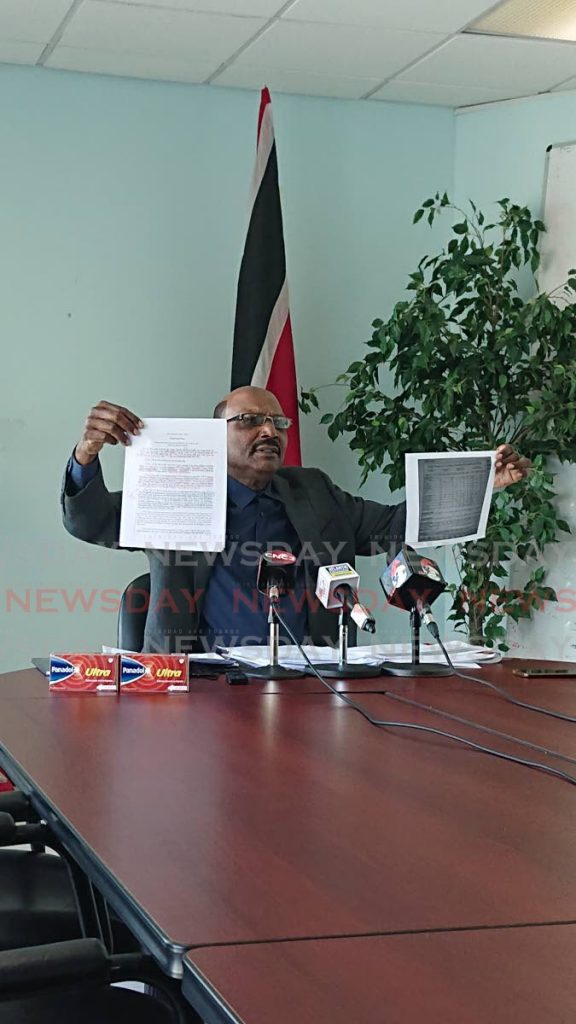 Opposition senator Wade Mark displays documents during a press conference on Saturday at the Opposition Leader's office in Port of Spain. - Ria Chaitram