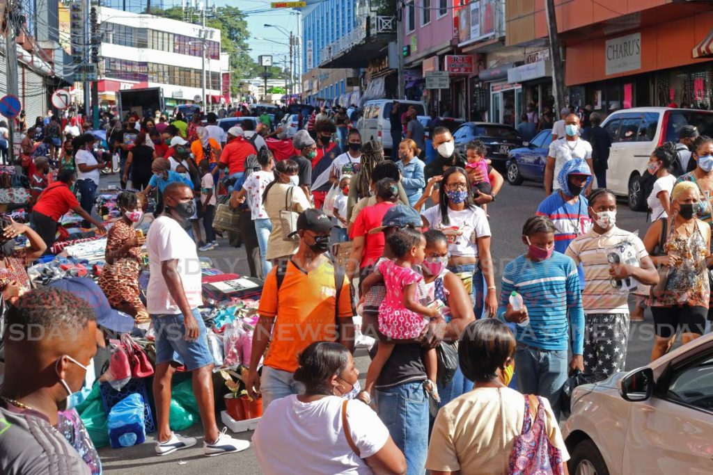 Shoppers on Christmas Eve on High Street, San Fernando. - File photo