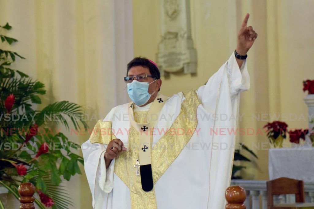 FOR THE CHILDREN: Archbishop of Port of Spain Rev Charles Jason Gordon gesticulates during Christmas mass at the Cathedral of the Immaculate Conception where he called for more love to be shown to the nation’s children. 
PHOTOS BY VIDYA THURAB - 