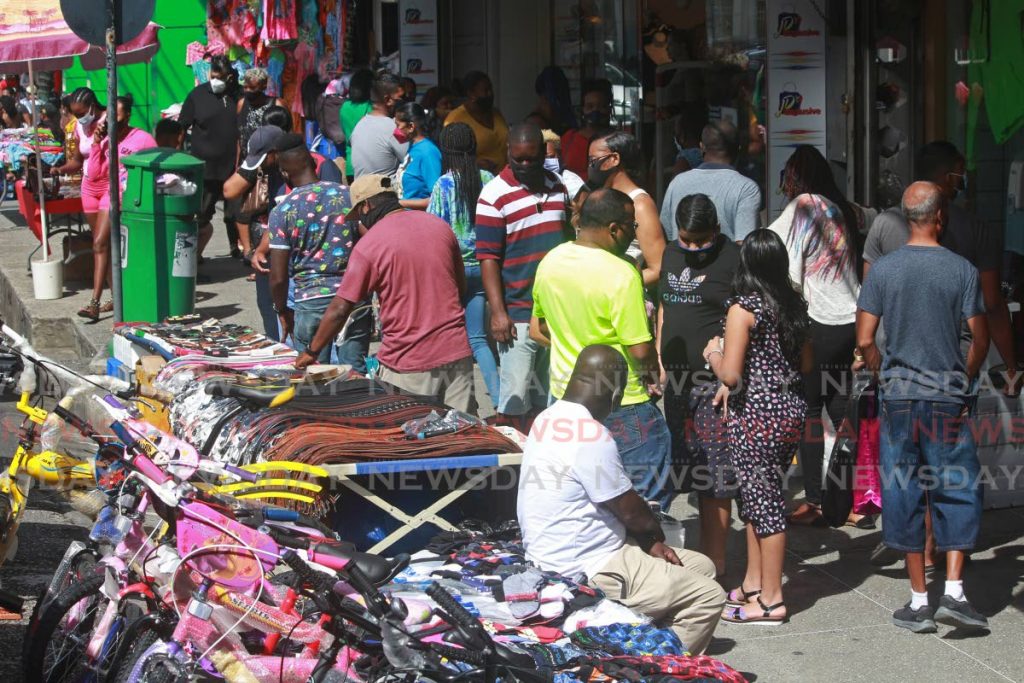 In this December 2020 file photo, vendors conduct sales on High Street, San Fernando.  