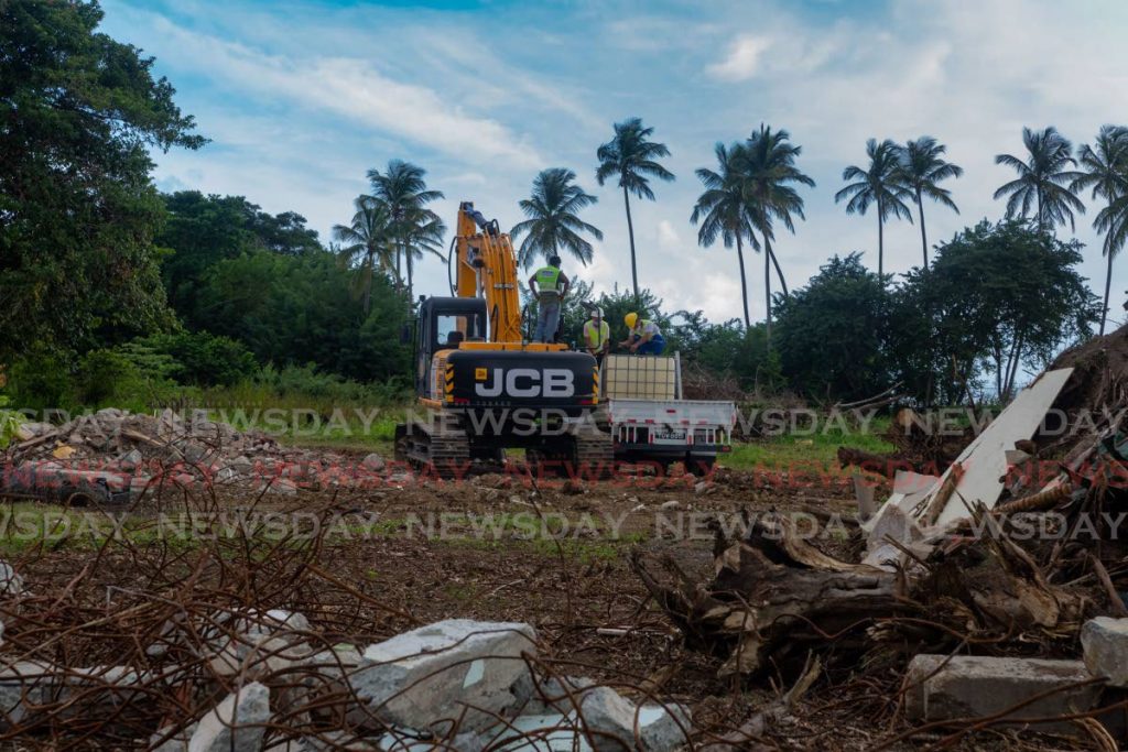 A bulldozer clears a site just off Silk Cotton Trace, Bon Accord, on Saturday. The lands are being prepared for the start of construction on the ANR Robinson airport expansion project next month.
PHOTO BY DAVID REID. - 