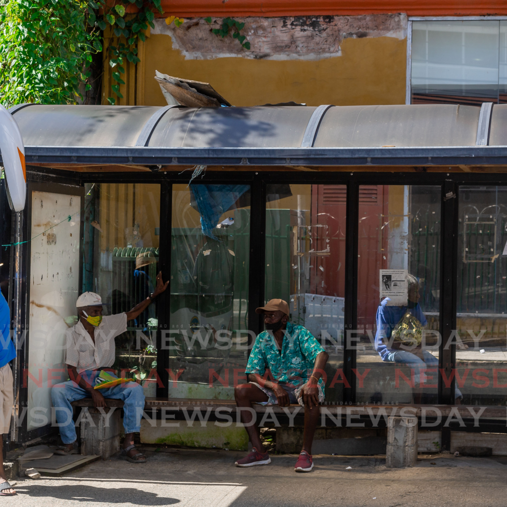 People sit at a bus shed, Market Square, Scarborough, last week. Photo by David Reid -