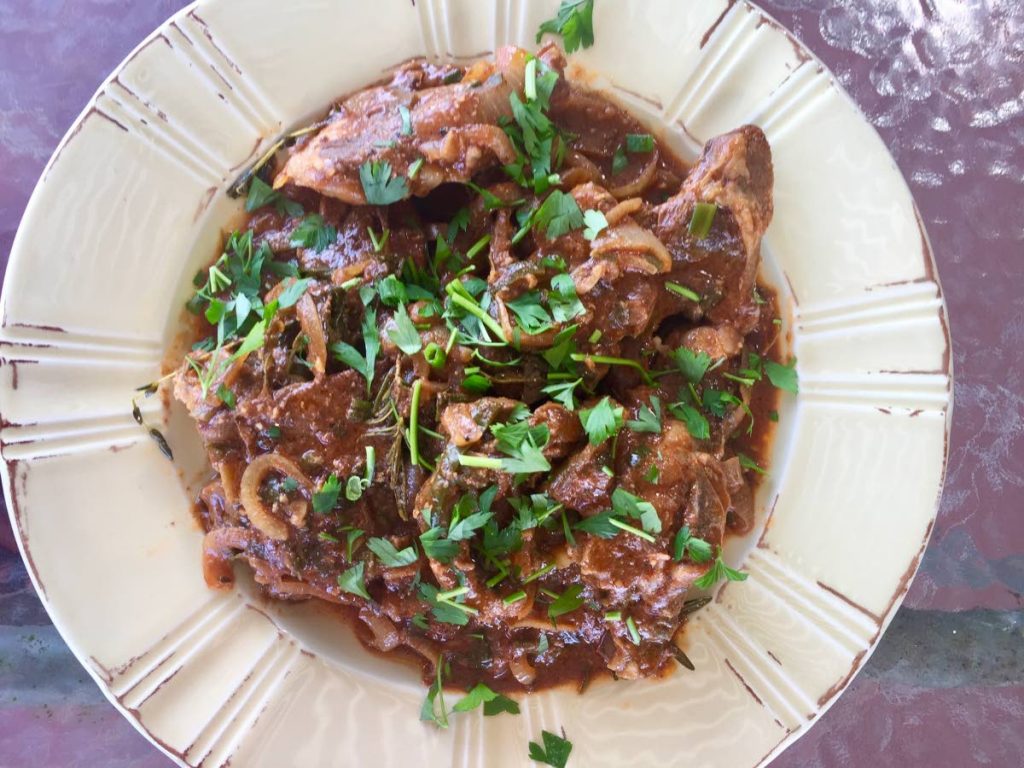 Braised goat shoulder chops with oregano and rosemary - 