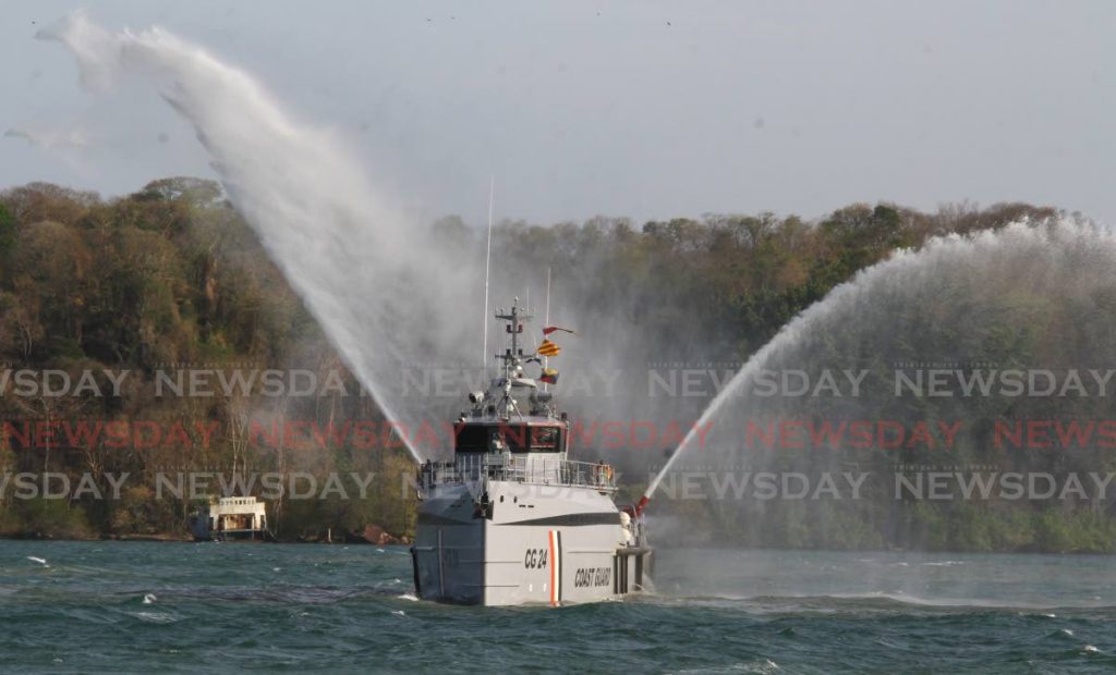 In this April 23, 2016 file photo, a Coast Guard offshore patrol vessel sprays sea water during the passing out ceremony of recruits in Chaguaramas. File photo/Roger Jacob  