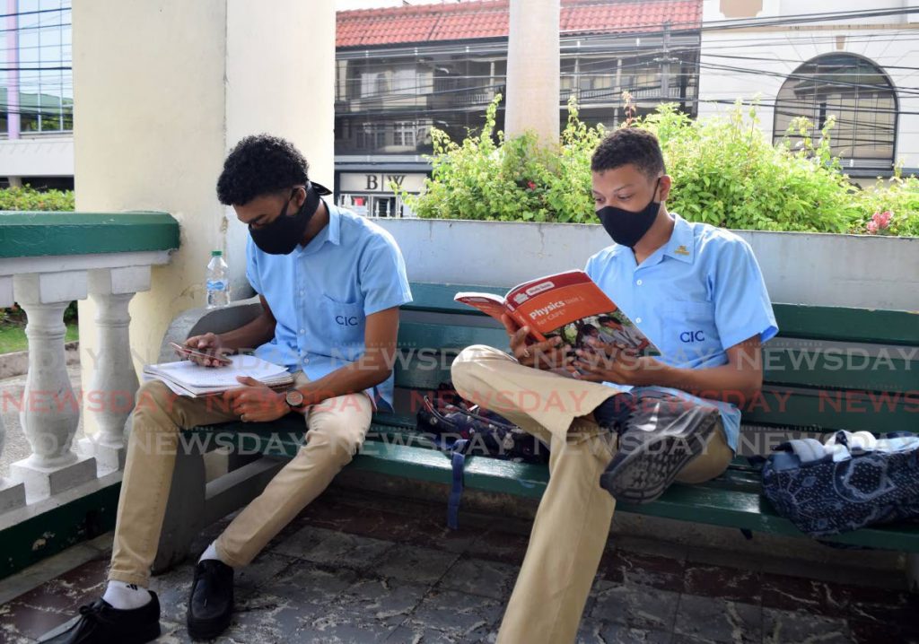 In this file photo from December 2020, Form 6 students of Saint Mary's College, CIC, do last minute revision before their CXC physics exam. Photo by Vidya Thurab