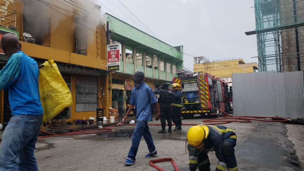 Fire officers at the scene of a fire on Independence Square. Photo by Roger Jacob