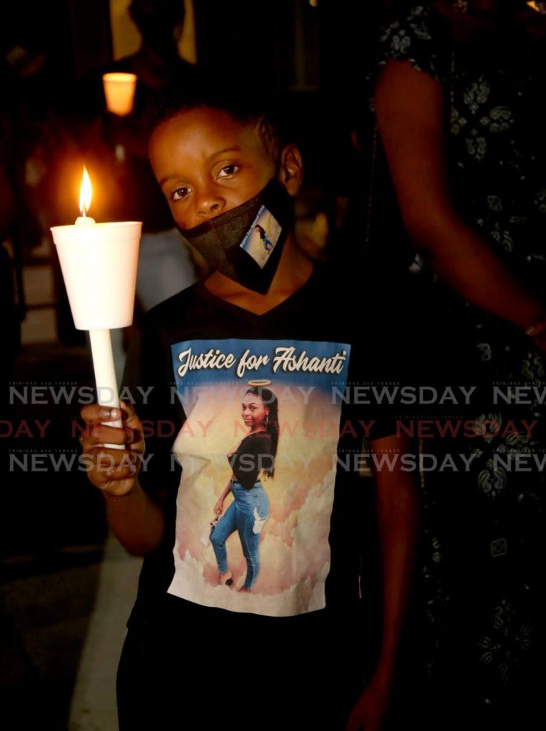 A young participant in a candlelight vigil for murder victim Ashanti Riley outside of the Red House, Port of Spain on December 12, 2020. PHOTO BY SUREASH CHOLAI - 