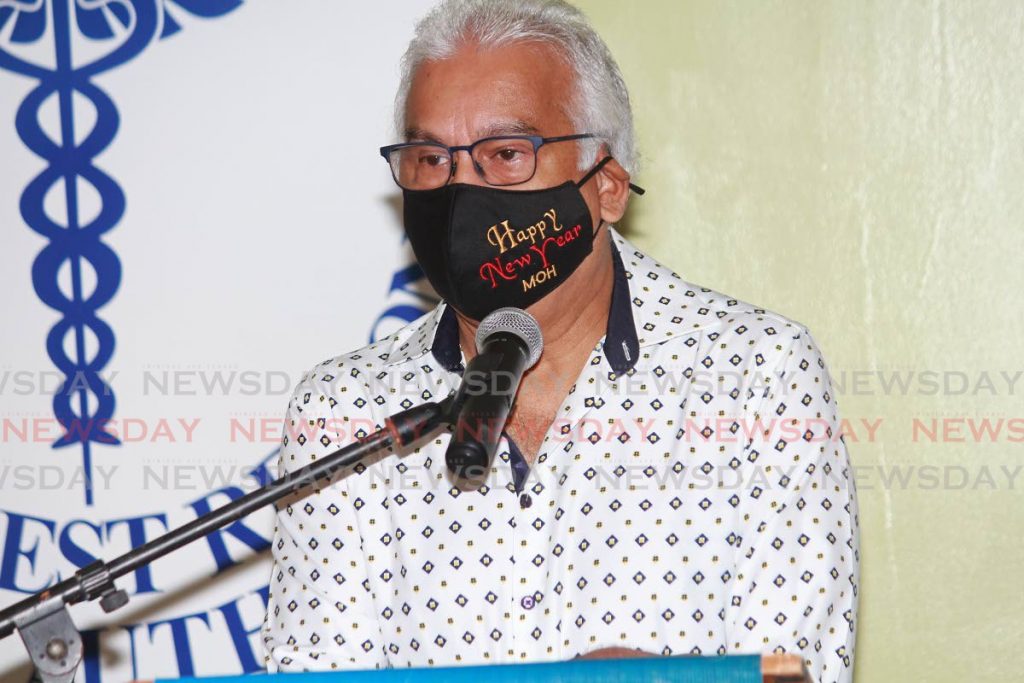 Health Minister Terrence Deyalsingh wears in a New Year's mask during a media conference at San Fernando Teaching Hospital on Friday. PHOTO BY CHEQUANNA WHEELER - 