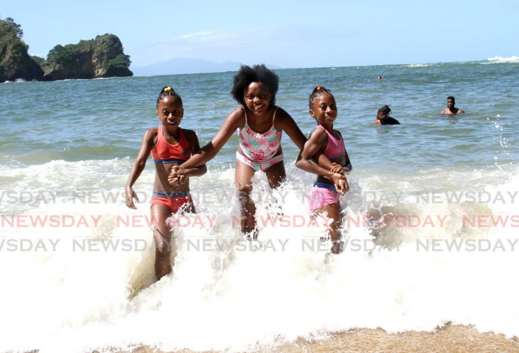 Ayodele Onilu, centre, with her friends Nyelle, left, and Nyomie Jobe. - Ayana Kinsale