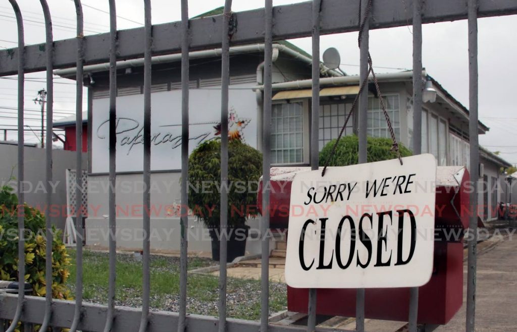 The gate of Paparazzi mas camp in Woodbrook was closed last week. Around this this the mas camp would have been busy as costumes got in order for masqueraders. - SUREASH CHOLAI