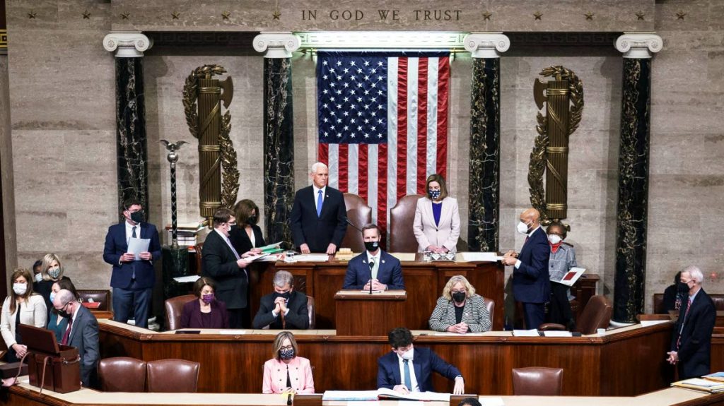 BACK IN BUSINESS: Hours after Trump supporters stormed Capitol Hill in Washington DC on Wednesday, US lawmakers and politicians including Vice President Mike Pence and House Speaker Nancy Pelosi (both standing under the US flag) completed the task Thursday morning of ratifying the US election results confirming Joe Biden as the next President of the United States. AP PHOTO - J. Scott Applewhite