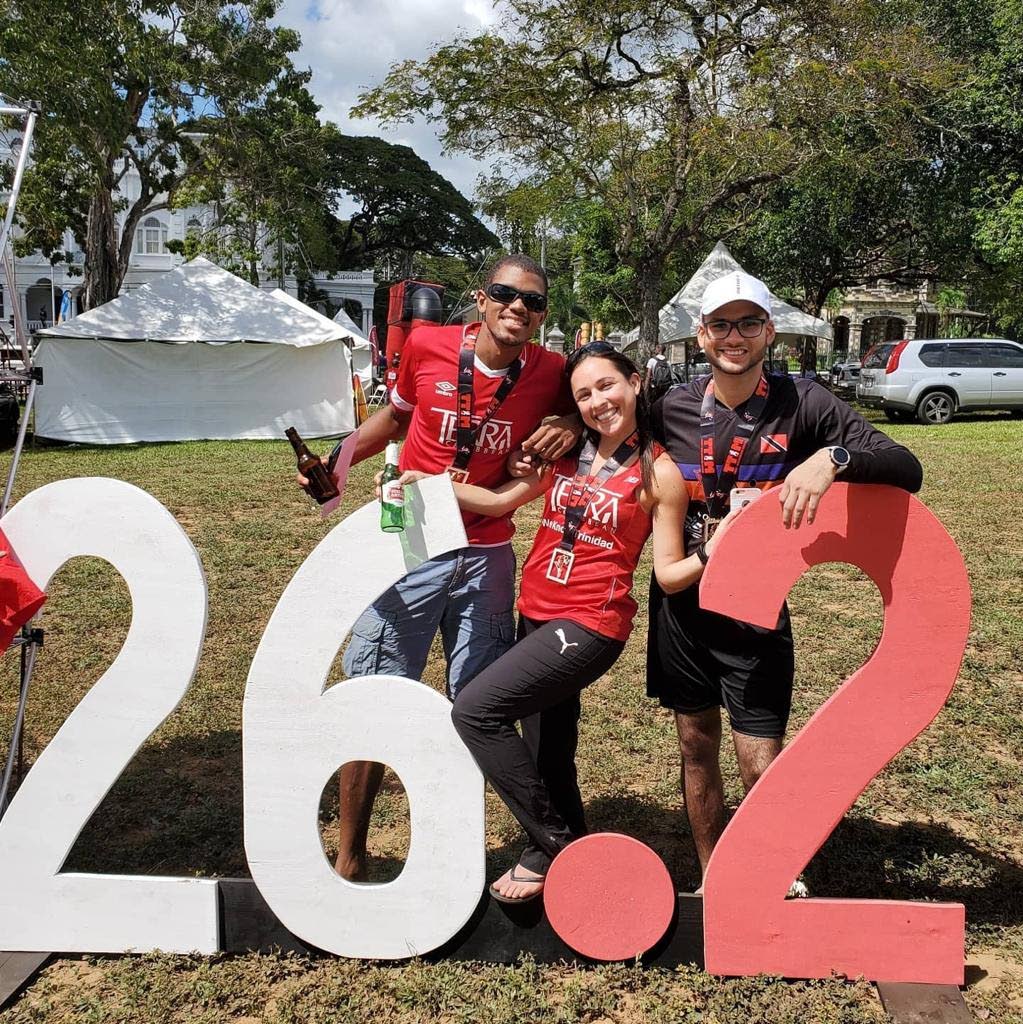 Last year's TTIM 26.2 mile women's runner-up Sjaelan Evans, centre, celebrates her silver medal performance with friends at the 2020 edition.  - 
