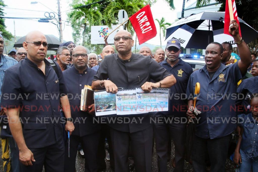 In this 2018 file photo, OWTU president Ancel Roget holds proposals for the restructuring of state-owned Petrotrin outside the Office of the Prime Minister in St Clair, Port of Spain. 