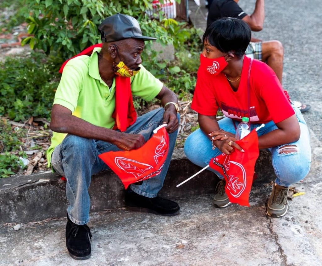 PNM candidate for Plymouth Golden Lane Melissa James Guy chats with a resident of the electoral district during a walkabout. - 