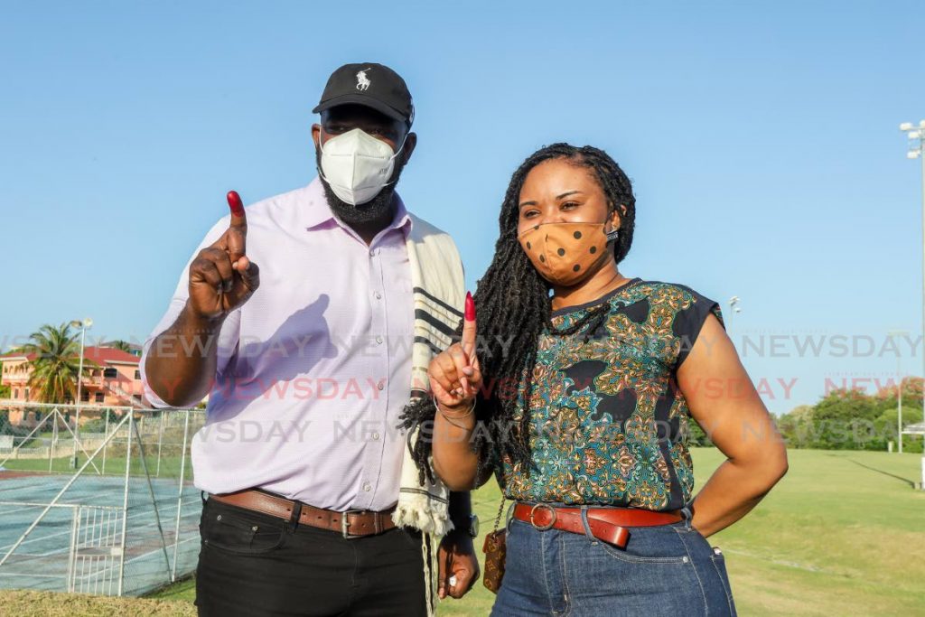 THA election 2021 PNM candidate Bethel/Mt Irvin Shomari Hector and Tobago west Shamfa Cudjoe display ink after voting at the Montgomery government primary school,  Mt Pleasant tobago - Jeff Mayers