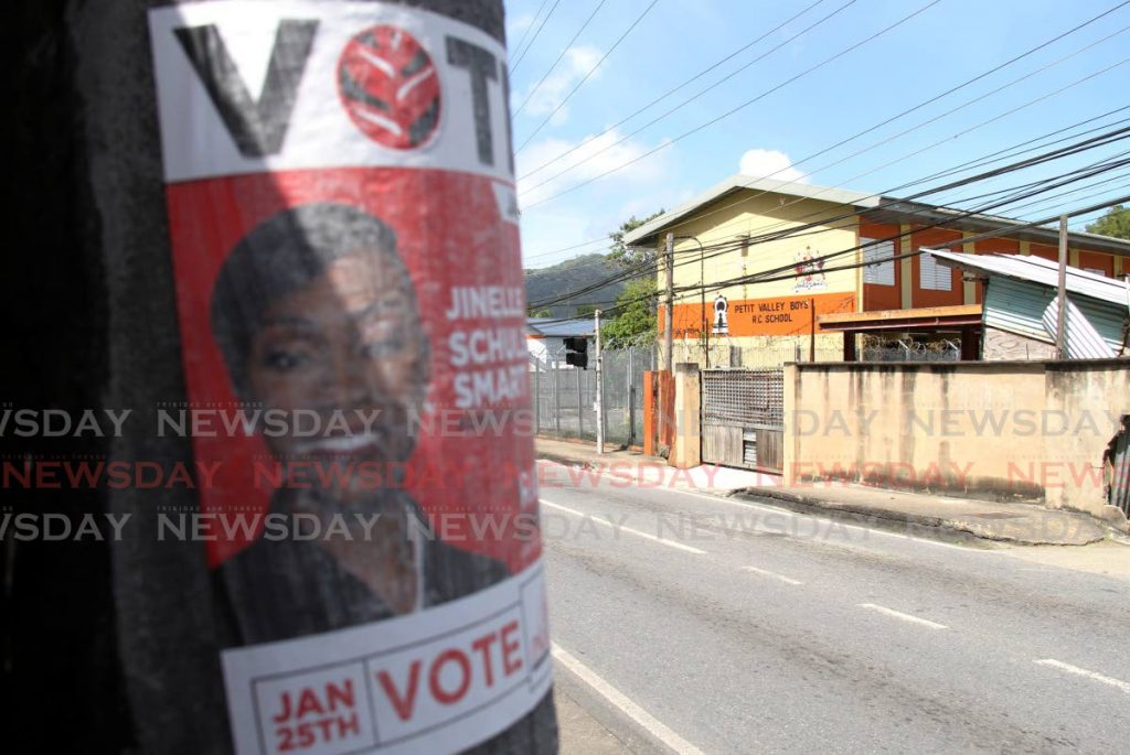 A poster plastered on a lamppost obliquely opposite the Petit Valley Boys' RC School which is one of the polling stations for the local government by-elections - AYANNA KINSALE