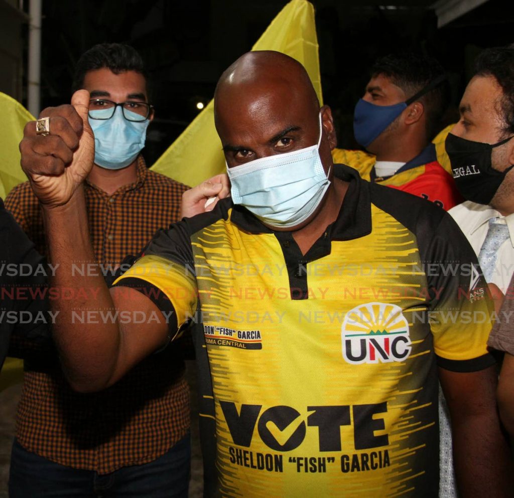 File photo: UNC's Sheldon 'Fish' Garcia, raise his hands in victory after winning the Arima Central seat. - Angelo Marcelle