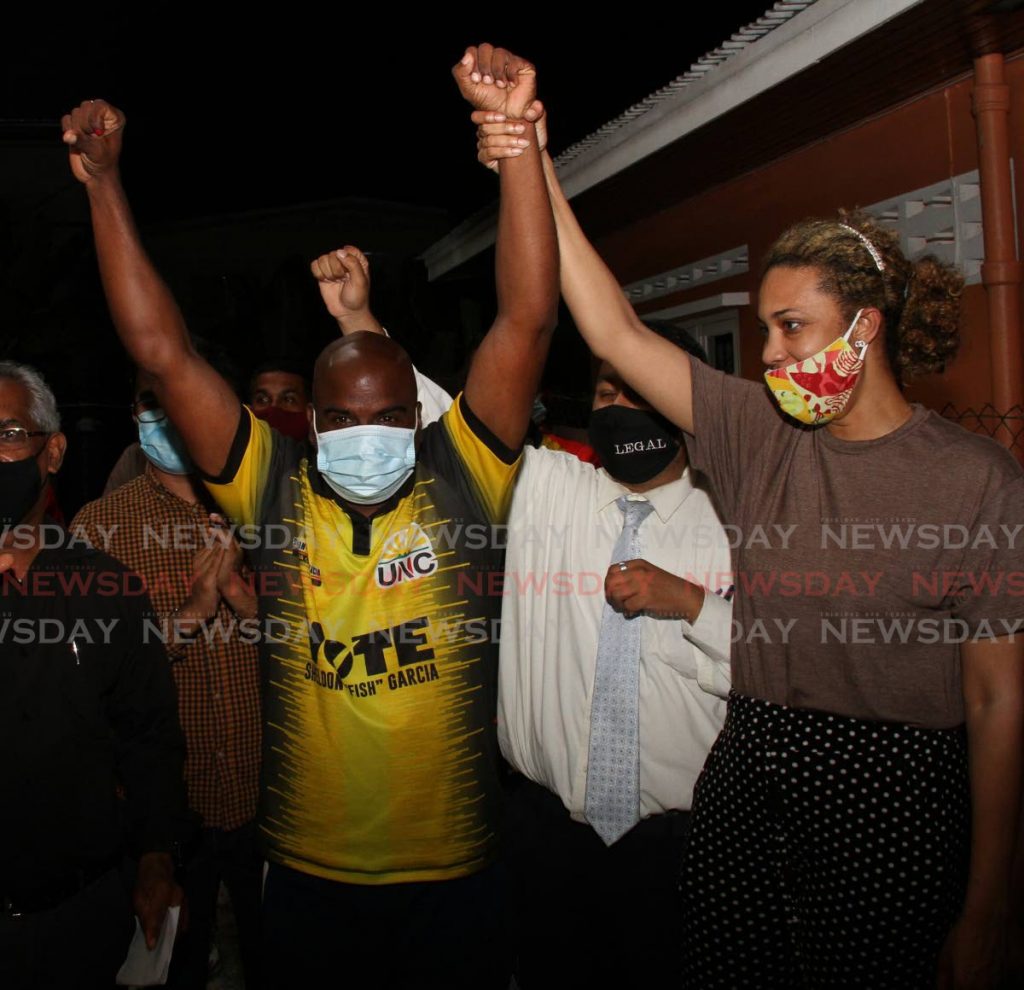 UNC's Sheldon 'Fish' Garcia, raises his hands in victory after being declared winner of the Arima Central seat in Monday's local government by-election. - Angelo Marcelle