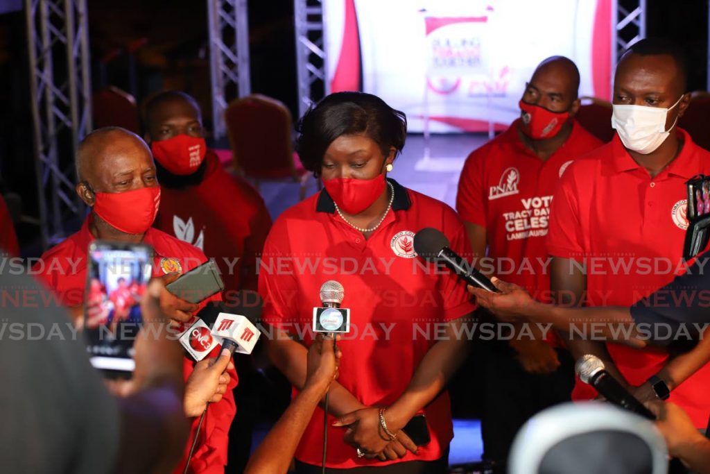 PNM Tobago Council leader Tracy Davidson-Celestine, centre, declares six seats for her party at PNM election headquarters in Scarborough on Monday evening. She is flanked by PNM Tobago Council chairman Stanford Callender, left, and Chief Secretary  Ancil Dennis. PHOTO BY JEFF MAYERS - 