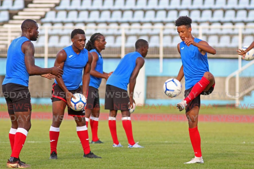 Gary Griffith III,right, takes part in a TT senior men’s team football training session, at the Ato Boldon Stadium, Couva, on Tuesday. TT are due to play a friendly against the US on January 31. - Marvin Hamilton