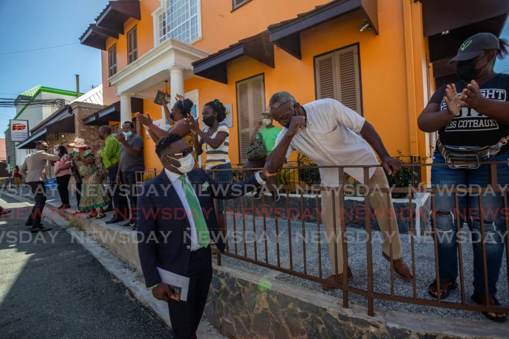 Patriotic Democratic Patriots leader Watson Duke greet supporters after he was sworn in as an assemblyman on Thursday in Tobago. - JEFF K MAYERS