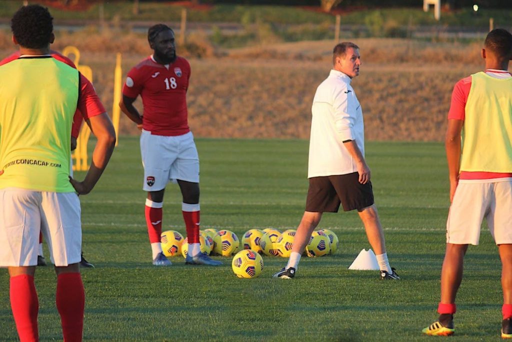 TT men's football team coach Terry Fenwick (centre) gives instructions during a training session at Orlando, Florida, US. PHOTO COURTESY TTFA. - 