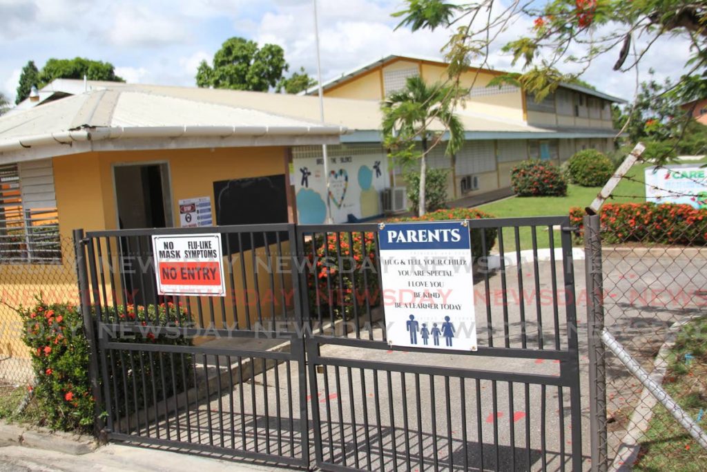 A sign on the compound of St Augustine South Government Primary School states visitors must wear masks. The Education Ministry has sent up a health unit to help mointor the safe reopening of schools starting with secondary schools on February 8. File photo - 