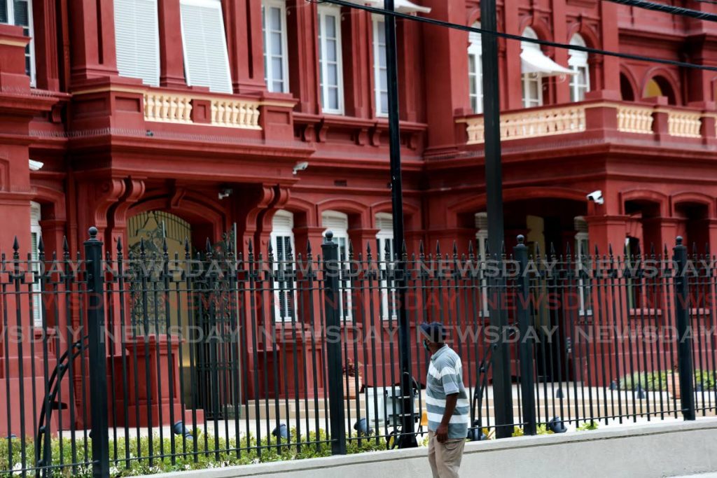 In this file photo a man stops to admire the Red House. - SUREASH CHOLAI