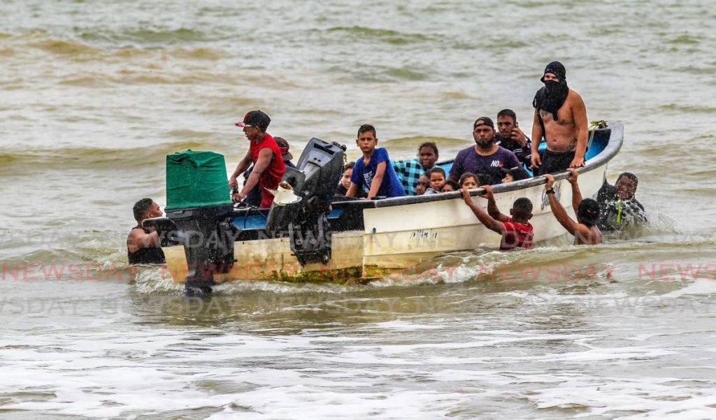 File photo: Illegal Venezuelan migrants arrive in a pirogue at Los Iros beach in Cedros in November 2020. 