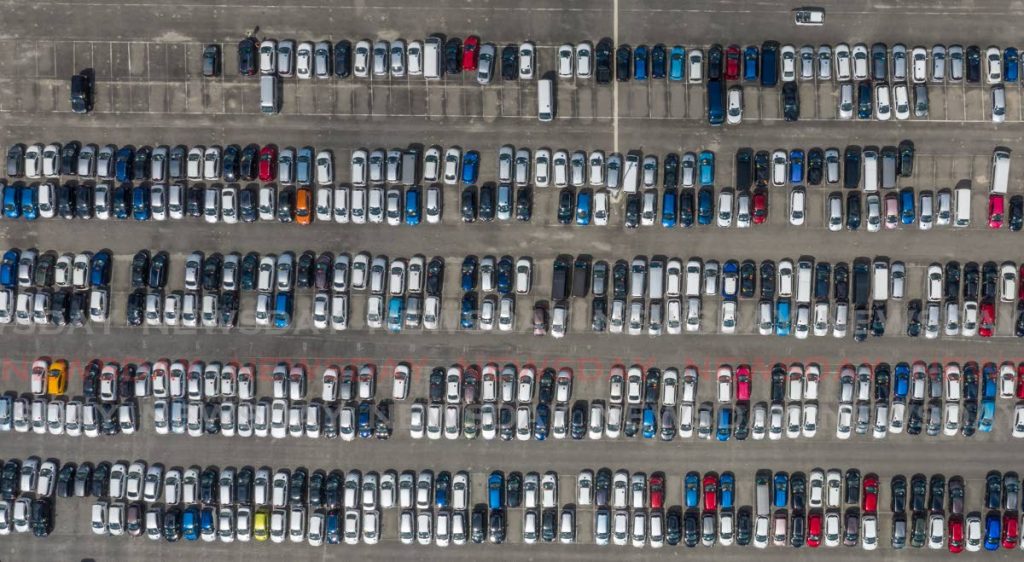 An aerial view of new and foreign used cars on the Port of Port of Spain - Jeff K. Mayers
