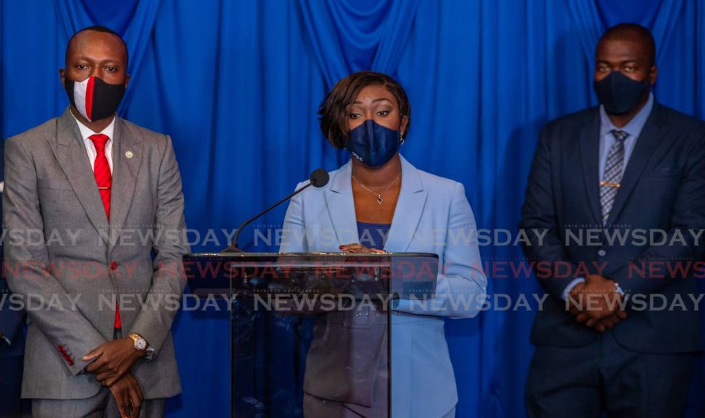 PNM political leader Tracy Davidson-Celestine, centre, with Chief Secretary Ancil Dennis, left, and Canaan/Bon Accord representative Clarence Jacob at the Assembly Legislature, Scarborough, last week. PHOTO BY JEFF K MAYERS - 