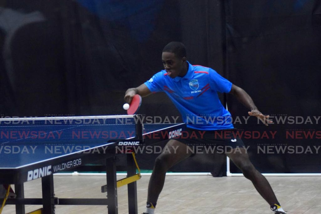 Derron Douglas of Queen’s Park Table Tennis Club returns the ball to Kenneth Parmanand of Renegades Racquet Centre in match one of the TTChampions League Table Tennis competition between Queen’s Park and Renegades Racquet Centre, Queen’s Park Oval, Port of Spain, on Saturday night. - Vidya Thurab