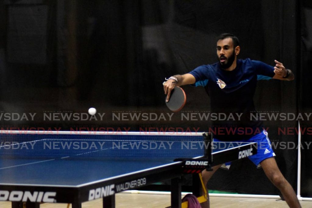 Hillview Renegades' Yuvraaj Dookram plays a shot during a previous match in the Table Tennis Champions League. Dookram won once and lost another against Solo Crusaders at the Himalaya Club on Thursday. PHOTO BY VIDYA THURAB - 